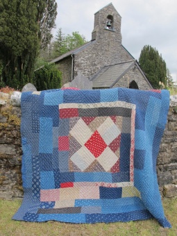 patchwork_quilt_on_church_wall